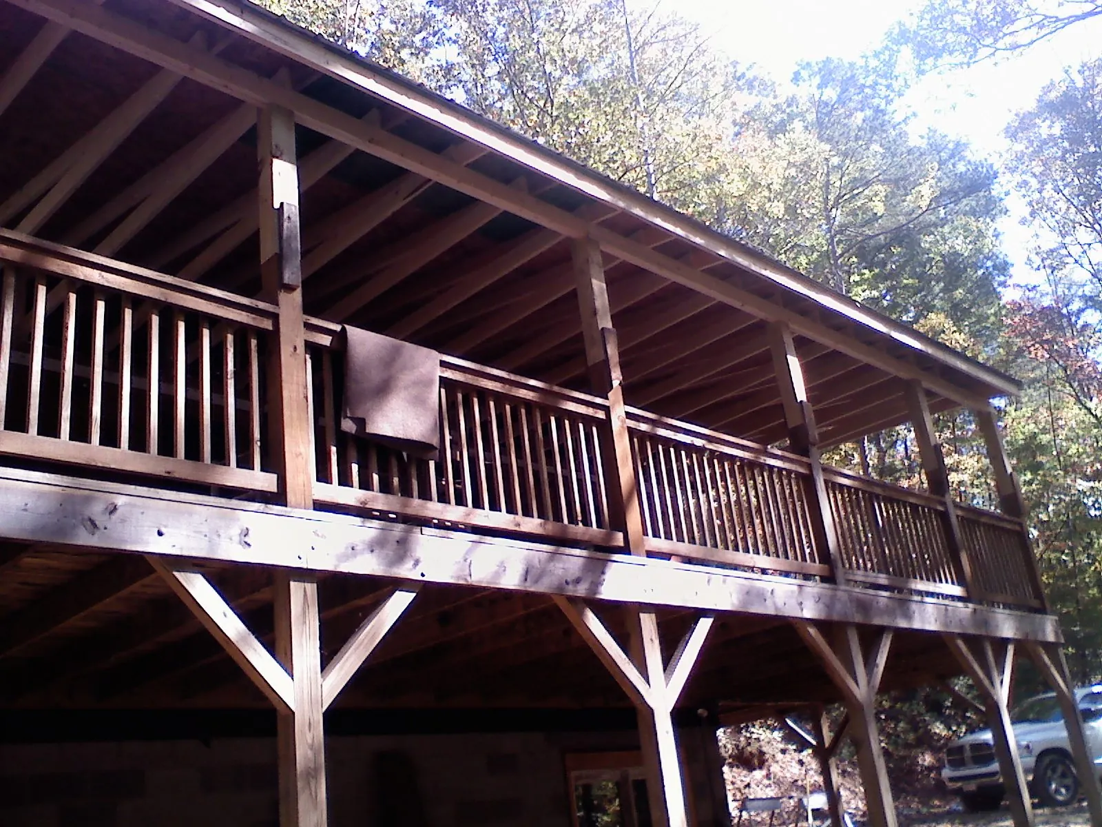 Timber framing under a new elevated porch and deck — Roof Leak Repair in Bellport by Roofing Brothers